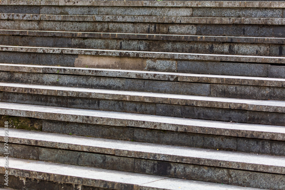 Old concrete steps on the stairs as background