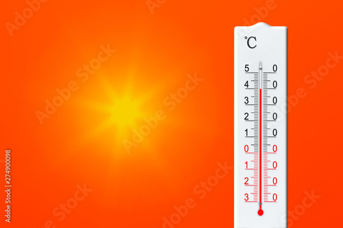 Yellow sun in red sky. Summer heat. Thermometer shows high temperature in summer. Air temperature plus 40 degrees