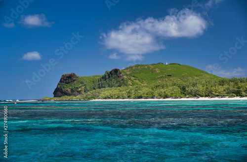 Beautiful island with rocks and vegetation over the ocean