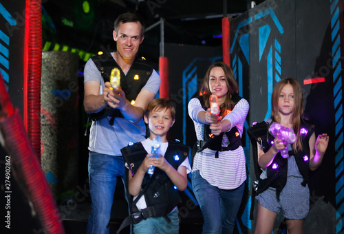 Parents and children playing laser tag © JackF