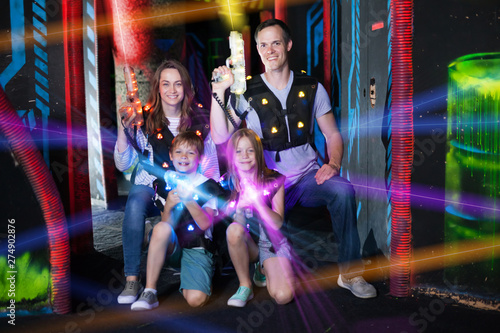 Kids and adults in beams on lasertag arena