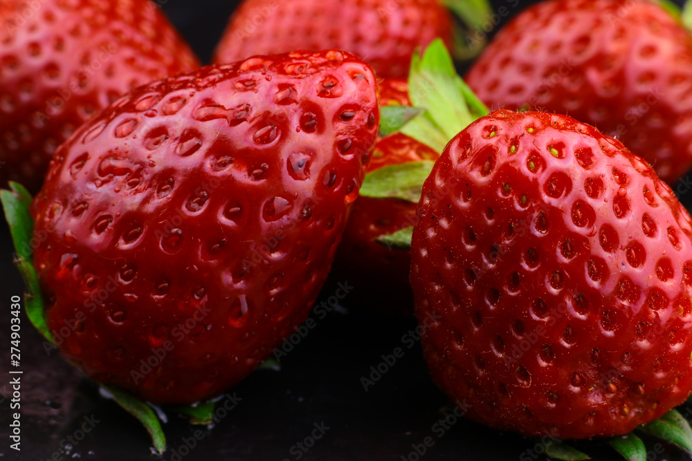 Strawberries. Red ripe strawberries background. Sweet strawberry with water drops Strawberries. Red ripe strawberries background. Sweet strawberry with water drops