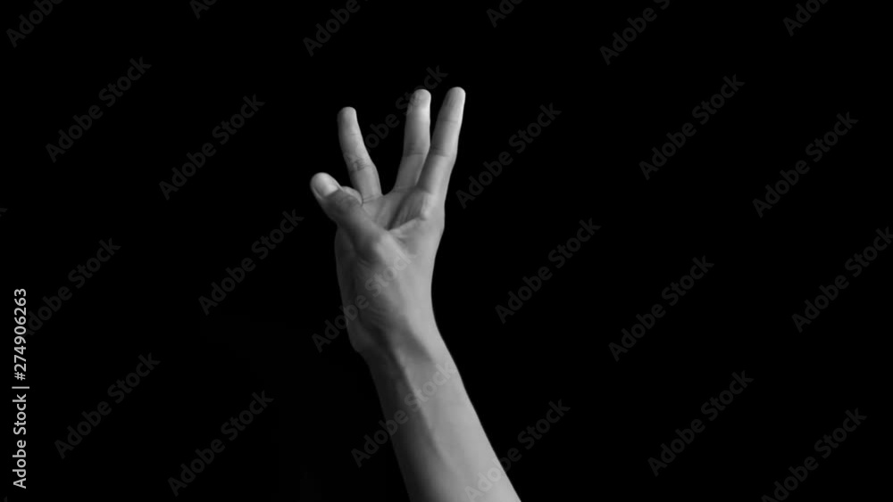 Hand coming up and showing number three sign isolated on black. Hand coming up and showing number three sign isolated on black.