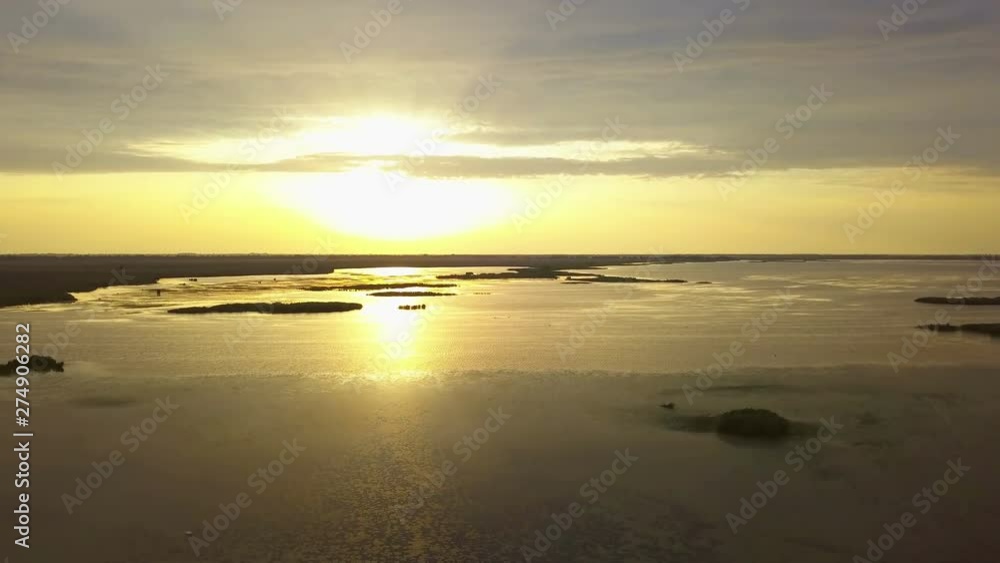 A beautiful sunrise on a lake in Danube Delta, aerial view