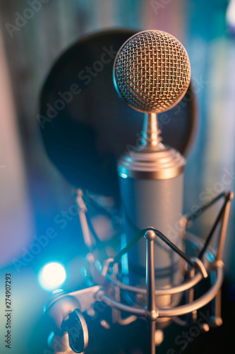 Blue Microphone at state in a studio recording session radio speech voice karaoke sing song composer harmony silence rhythm lesson class learn discover practice digital technlogy 