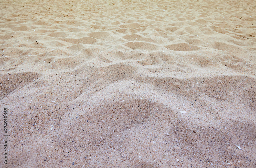 Fine beach sand in the summer sun Fine beach sand in the summer sun