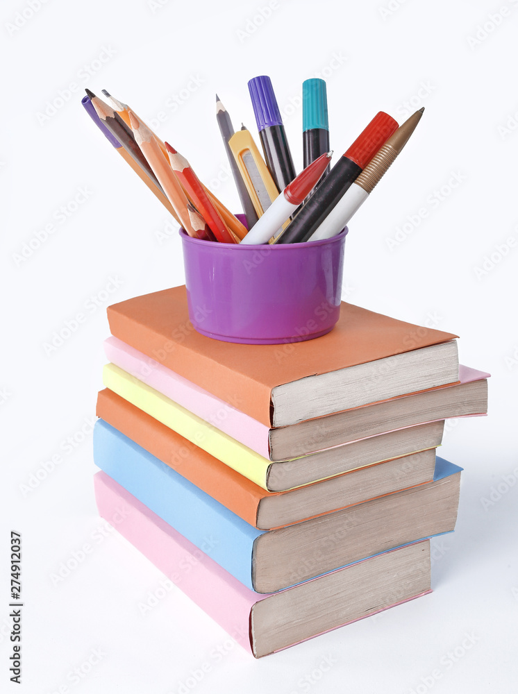 stand with pencils on a stack of books .photo with copy space stand with pencils on a stack of books .photo with copy space
