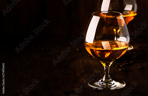 Armagnac, French grape brandy, strong alcoholic drink. Still life in vintage style, selective focus photo