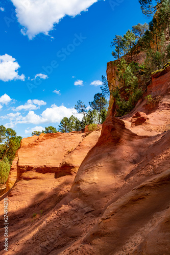 Large colorful ochre deposits, located in Roussillon, small Provensal town in Natural Regional Park of Luberon, South of France