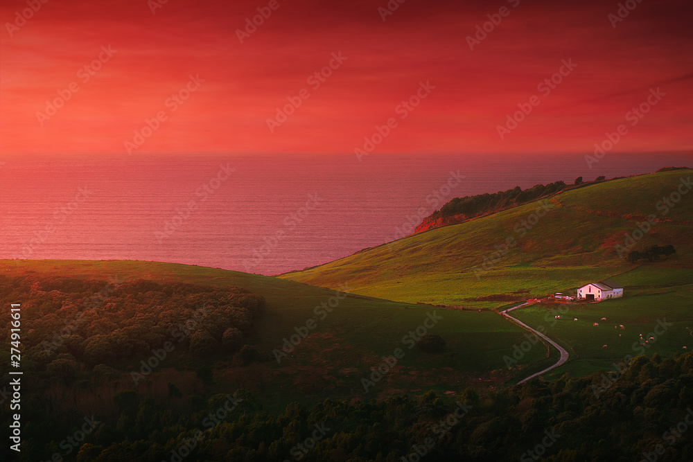house in Gorliz near the sea with red sunset sky house in Gorliz near the sea with red sunset sky