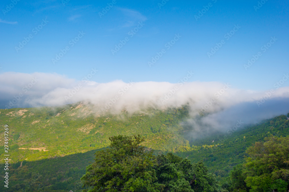 Scenic landscape of green hills and rocky mountains of the island of Sardinia in spring Scenic landscape of green hills and rocky mountains of the island of Sardinia in spring