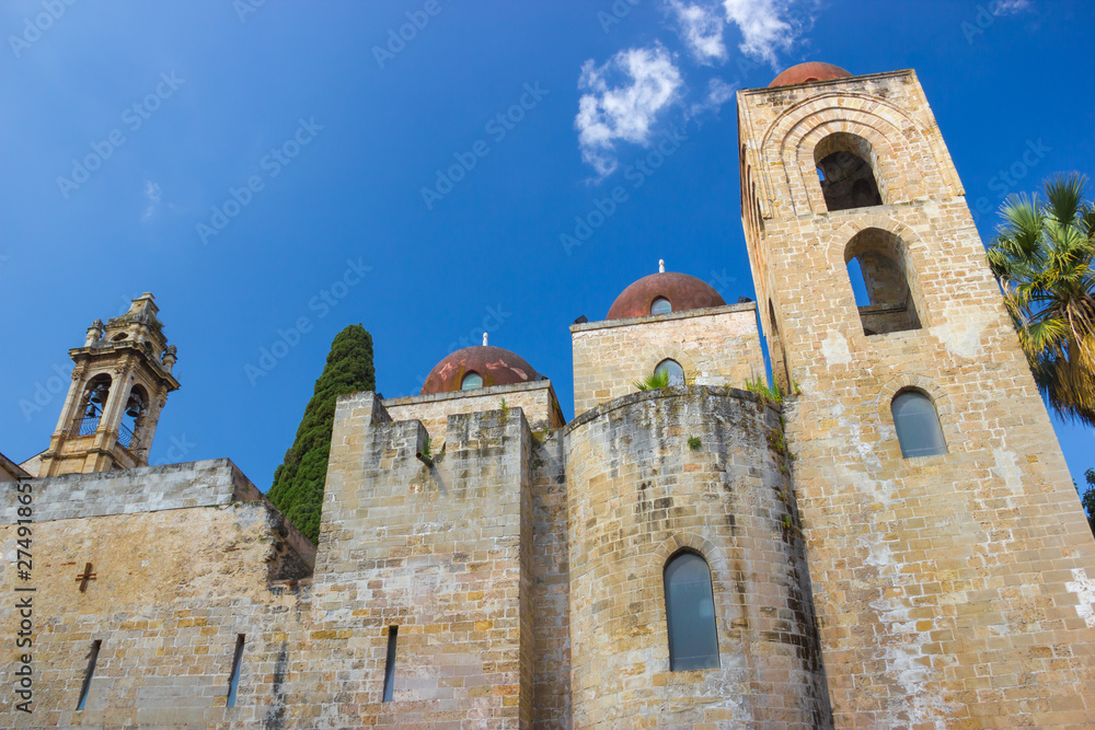 Historic heritage of church San Giovanni degli Eremiti in arabic architecture, old facade and bell tower in yellow bricks