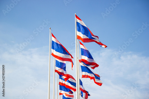 The National Flag Of Thailand with blue sky background