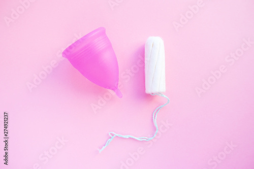 Reusable menstrual cup and tampon on pink background, Concept female intimate hygiene period products and zero waste. Flat lay, minimalism, top view. copyspace. © Наталия Кузина