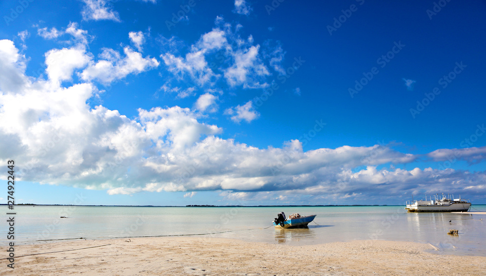 Shallow water with a beached boat in the Bahamas