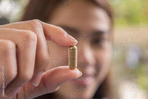 woman hand holding a pills take medicine according to the doctor s order