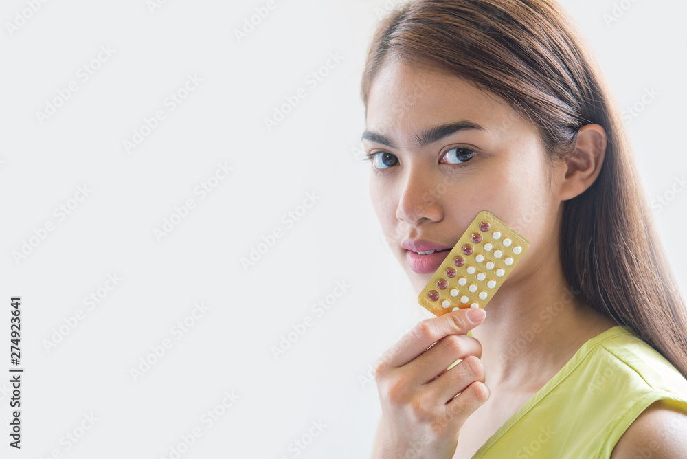 Woman hand holding a contraceptive panel prevent pregnancy Woman hand holding a contraceptive panel prevent pregnancy