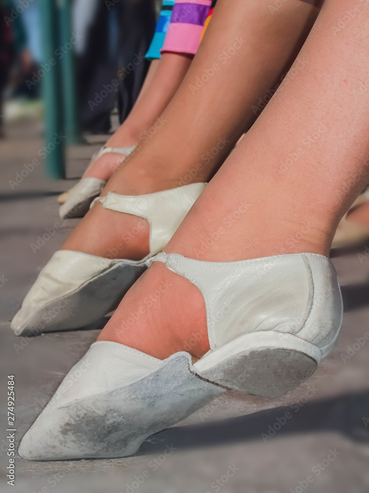Feet of women with dancing shoes, of young woman