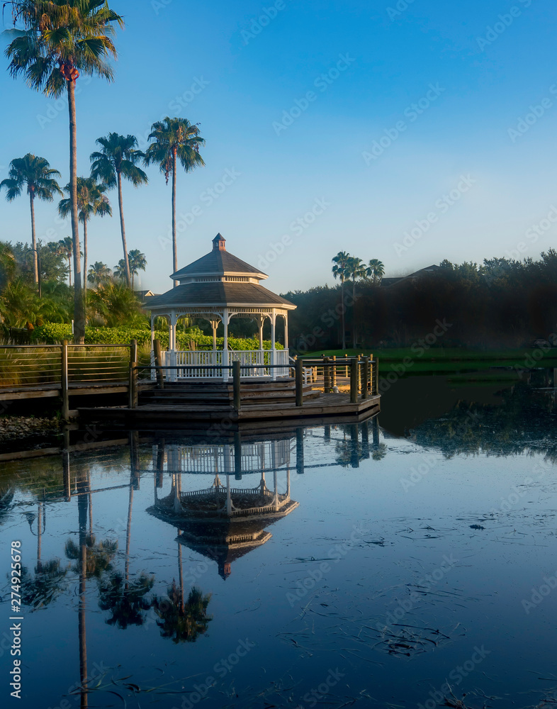 Gazebo provides a restful peaceful place to relax and eperience peace in the morning light .