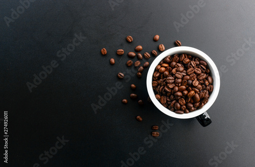 coffee bean in cup on black background