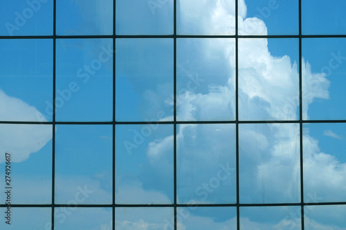  Clouds reflected in the glass facade of a skyscraper