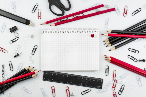 Composition of stationery in red and black color on a white background. Space for text.