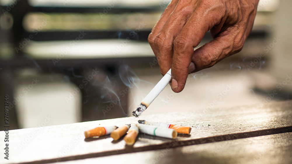 Smoking makes people around us unhealthy. The concept of stop smoking. Smoking makes people around us unhealthy. The concept of stop smoking.