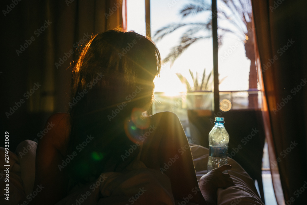 Woman enjoying a lazy morning in the hotel room. Gran Canaria, Spain. Woman enjoying a lazy morning in the hotel room. Gran Canaria, Spain.