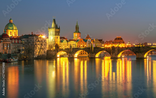 Sunset view on Prague old town and iconic Charles bridge on Vltava river, Czech Republic