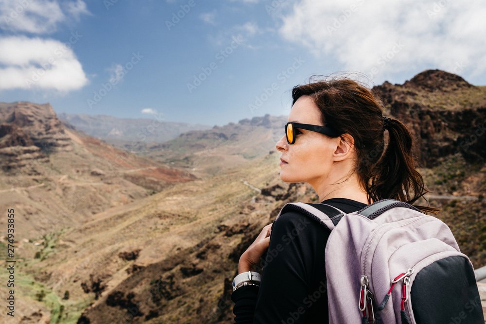 Active holidays, young woman on Gran Canaria mountain trails. Spain, Europe.