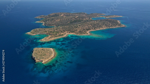 Aerial drone photo of famous anchorage for yachts small island of Fleves near iconic Lemos Peninsula in Vouliagmeni area, Saronic gulf, Attica, Greece