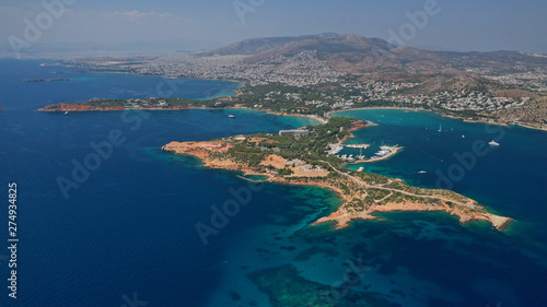 Aerial drone photo of famous luxurious Lemos peninsula in Vouliagemeni area with iconic celebrity sandy beach of Asteras, Athens riviera, Glyfada, Attica, Greece © aerial-drone