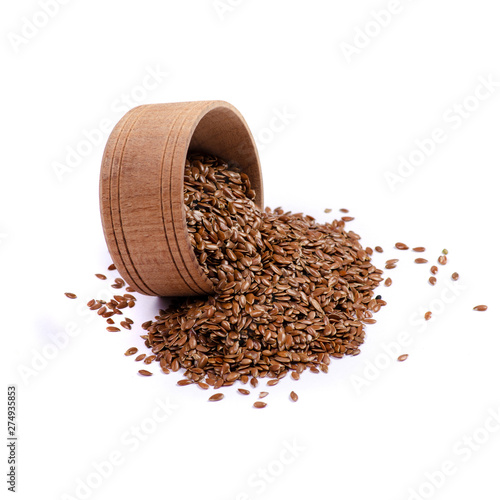 flax seeds in wooden bowl on white background isolation
