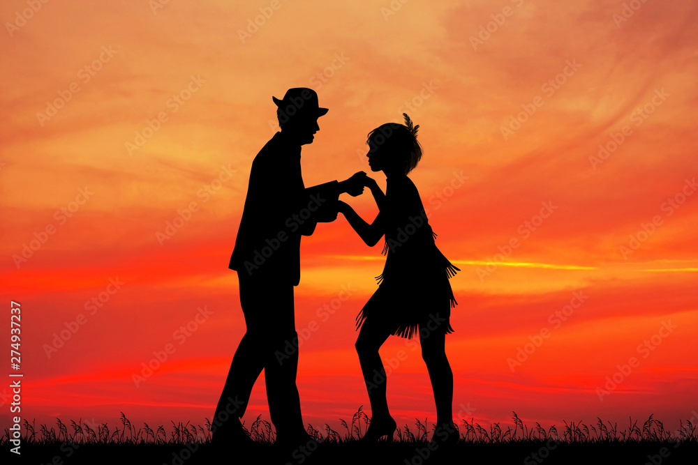 couple dances charleston at sunset