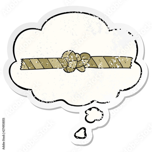cartoon knotted rope and thought bubble as a distressed worn sticker