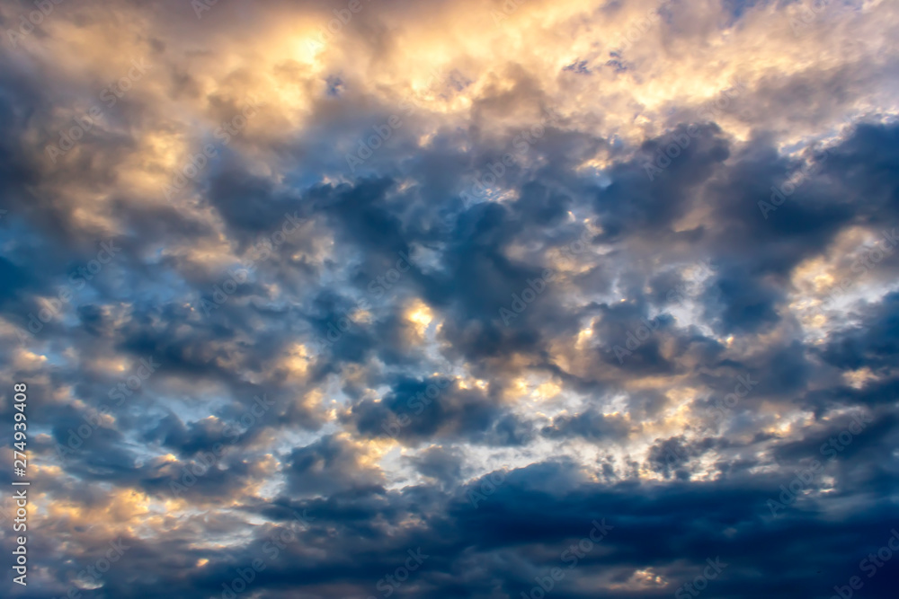 Colorful dramatic sky with cloud and sunlight at sunset Colorful dramatic sky with cloud and sunlight at sunset