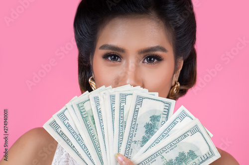 Happy Fashion beautiful woman hand holding dollar money