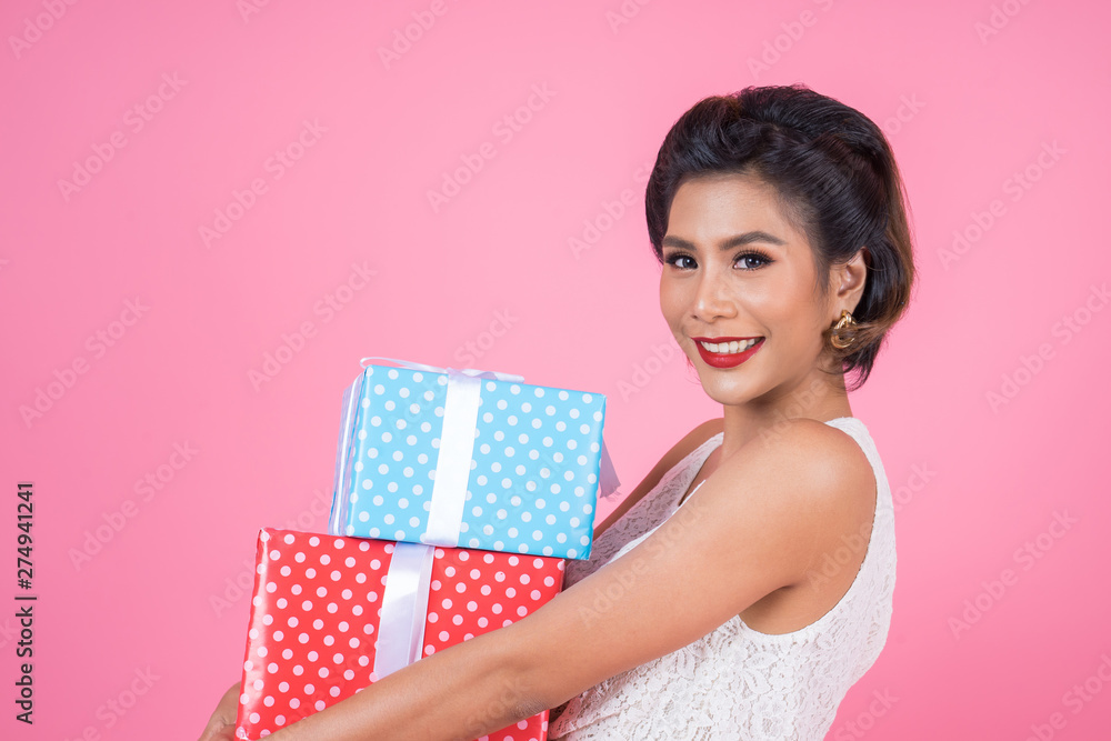 Beautiful happy woman with surprise gift box Beautiful happy woman with surprise gift box
