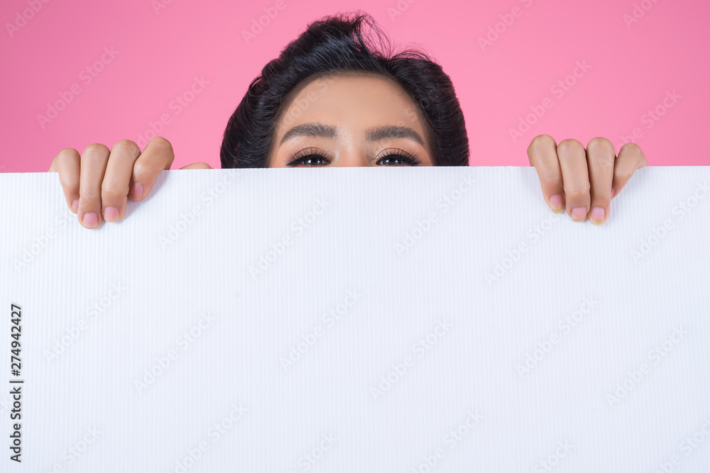 Portrait of fashion woman displaying white banner