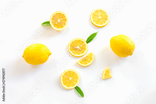 Ripe lemon and slices with leaves isolated on white background,Flat lay.