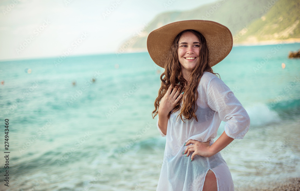 A happy young girl and a Mediterranean sea A happy young girl and a Mediterranean sea