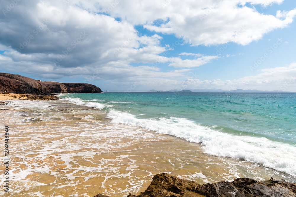 Panorama of beautiful beach and tropical sea of Lanzarote. Canaries Panorama of beautiful beach and tropical sea of Lanzarote. Canaries