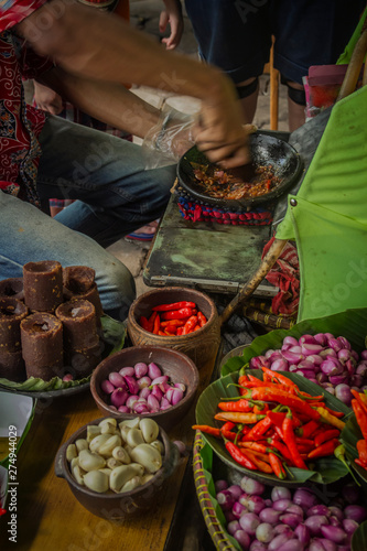 The seller is making special sambal for traditional fried tofu	