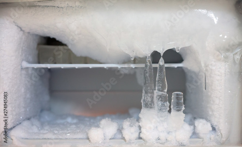Ice crystals icebox freezer in refrigerator photo