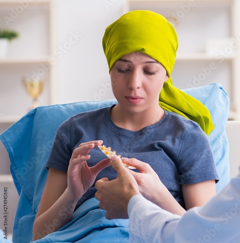 Cancer patient visiting doctor for medical consultation in clini photo