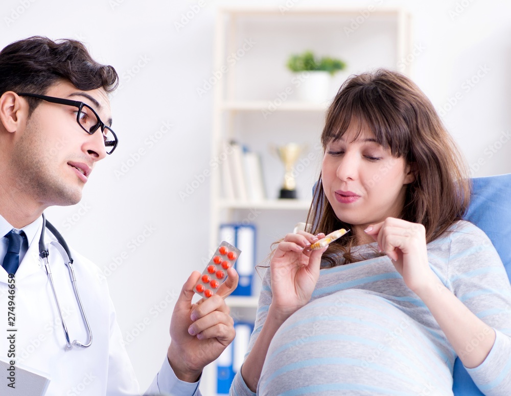 Pregnant woman visiting doctor for consultation Pregnant woman visiting doctor for consultation
