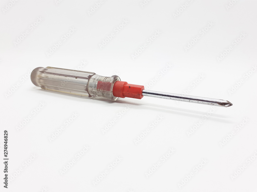 Metallic used rusty screwdriver in White isolated background Metallic used rusty screwdriver in White isolated background