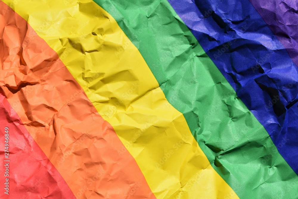 Crumpled paper background with rainbow colors