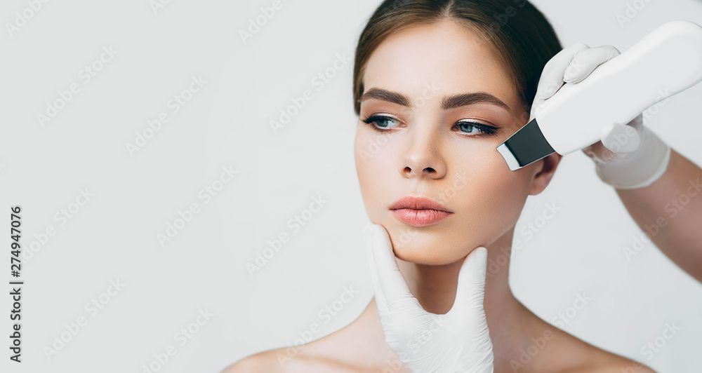 shot of woman's face while procedure ultrasound cavitation, facial peeling shot of woman's face while procedure ultrasound cavitation, facial peeling