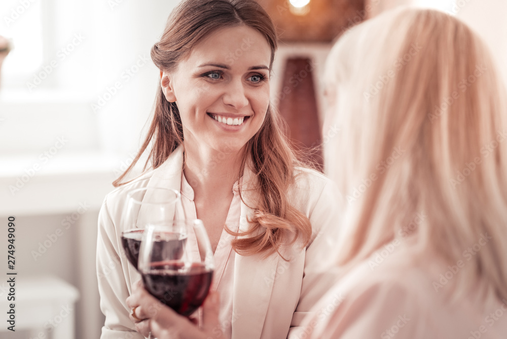 Blue-eyed lady celebrating her engagement with her mother Blue-eyed lady celebrating her engagement with her mother